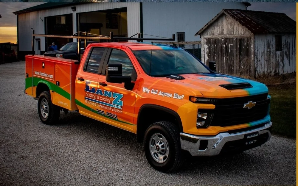 Same commercial service truck fully wrapped in branded colors, after Aftershock fleet wrap