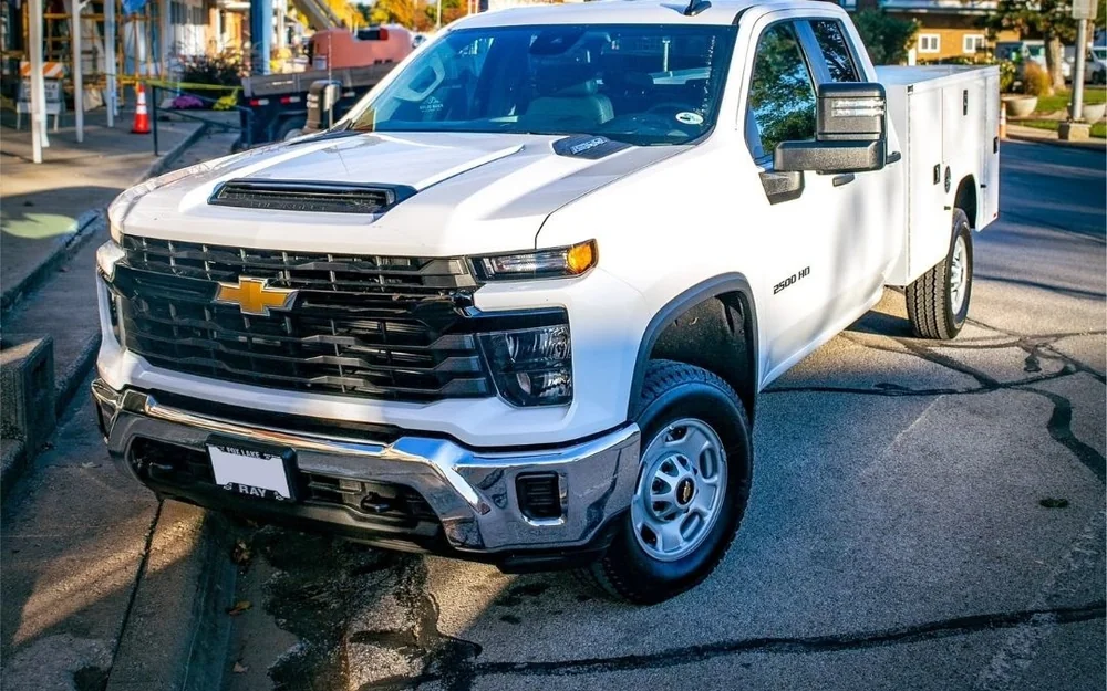 Unwrapped white commercial service truck, before Aftershock fleet wrap